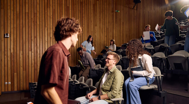 Students get ready for the beginning of a lecture in the amphitheater