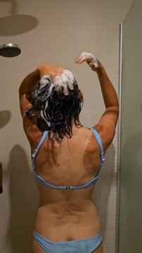 Woman shampooing her hair in the shower with soap lathering and rinsing steps shown throughout the process
