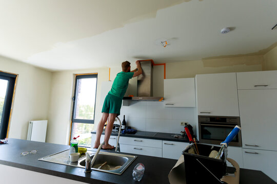 Person Working on Home Kitchen Renovation