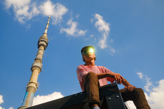 Man In Sunglasses With Sun Glare In An Urban Environment