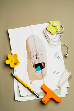Scattered daily objects and  stationery on sneaker photo