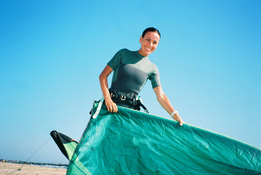 Preparing Kiteboarding Gear on Beach