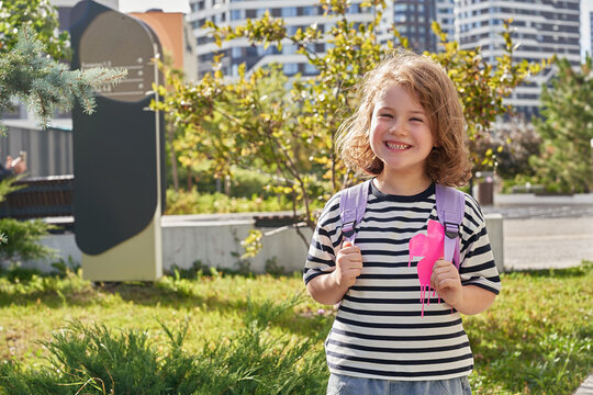 Schoolchild smiles on first day of elementary school