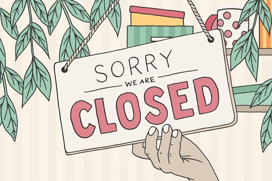 Small Business Owner Hanging Closed Sign