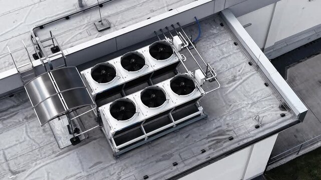 Rooftop air conditioning condensers in summer sunlight
