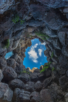 Italy, Sardinia, Toralba.   Interior of the Nuraghe Santu Antine archeological site.  Looking up at the sky. 