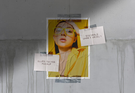 Glued Poster Mockup Against The Concrete Wall