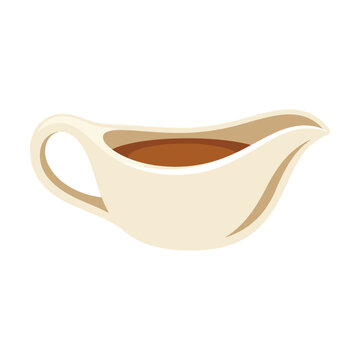 Ceramic gravy boat filled with brown sauce for holiday dinner