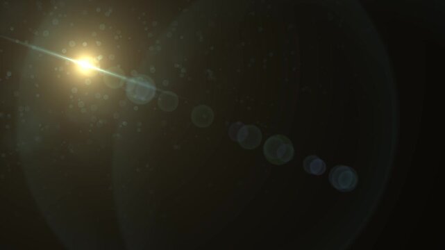 Abstract bright light burst with optical lens flare, Bright explosion of fire and light in a starry night sky with a optical lens flare.