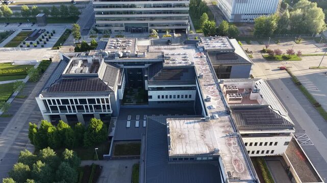Contemporary business office buildings surrounded by trees aerial perspective
