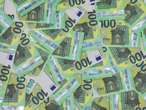 Cash. 100-euro banknotes overlapping. Business concept. Money background.
