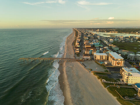 Aerial view of the Carolina Beaach Pier and ocean front homes in Carolina Beach, North Carolina, near Wilmington