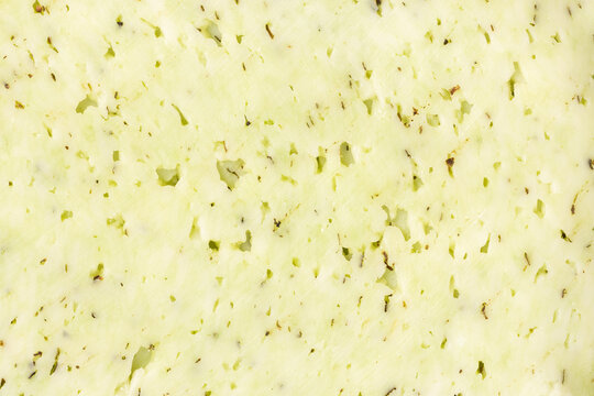Herb cheese showing texture and delicious holes