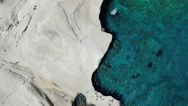 Aerial View of Sarakiniko Beach Cove with Sunbathers, Milos, Greece