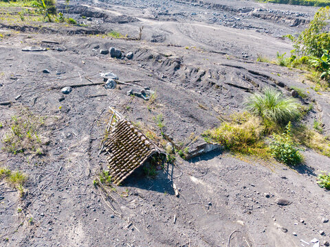 Aerial view of the volcanic ash and debris covering the landscape in the aftermath of the Mount Semeru eruption in Supiturang Village, Pronojiwo, East Java, Indonesia.