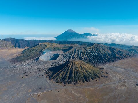 Aerial view of Mount Bromo volcano complex with its dramatic crater, rugged slopes, and surrounding volcanic landscape in Tosari, East Java, Indonesia.