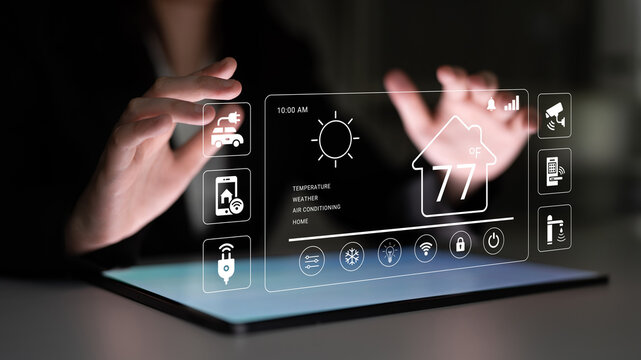 Digital Smart Home Interface with Temperature Control and Weather Display on a Touchscreen Device in a Modern Living Space. Glyphic.