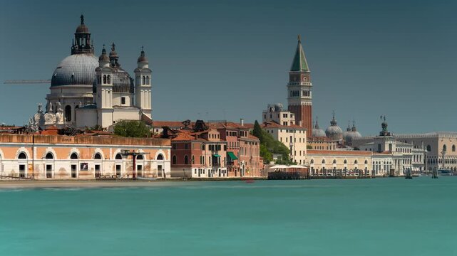Venice Italy skyline timelapse featuring Santa Maria della Salute dome, Saint Mark Campanile, and flowing turquoise lagoon water
