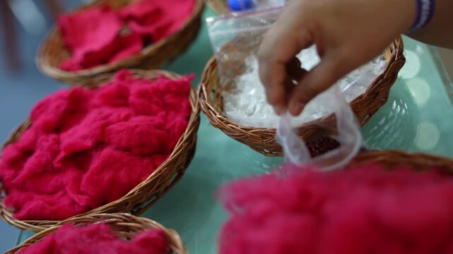 Dyed Red Cotton Fiber in Woven Baskets,Close-up of Red Dyed Fiber Samples