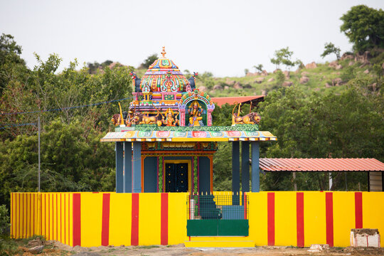 Indian Hindu Temple Under a Mountain &ndash; Traditional Temple and Scenic Landscape. The temple and surrounding landscape represent the close connection between Indian spirituality and nature.