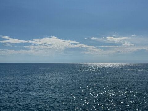 Serene ocean blue calm waters and sunny clear sky