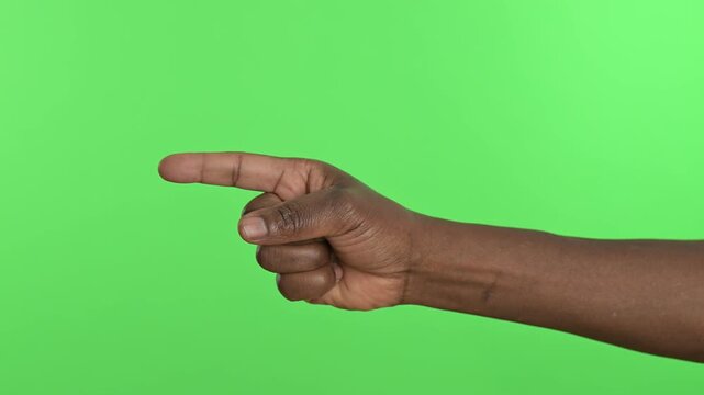 Person pointing finger to show something, isolated on green screen