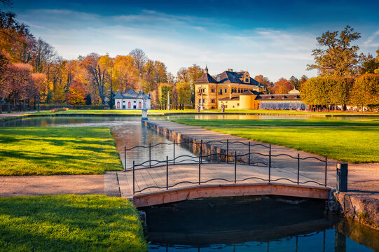 Sunny autumn view of Hellbrunn castle, Austria, Europe. Colorful morning cityscape of Morzg, district of Salzburg city, Austria, Europe. Traveling concept background.