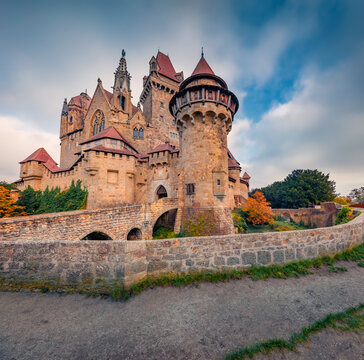 Gorgeous autumn view of Kreuzenstein medieval castle with half-timbered buildings. Incredible evening cityscape of Leobendorf, Austria, Europe. Traveling concept background.