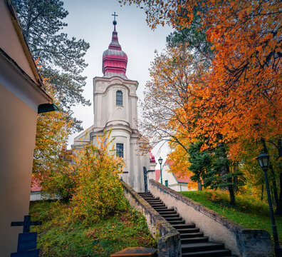 Calm evening view of Catholic church of Loosdorf, Austria, Europe. Captivating autumn scene in austrian countryside. Traveling concept background.