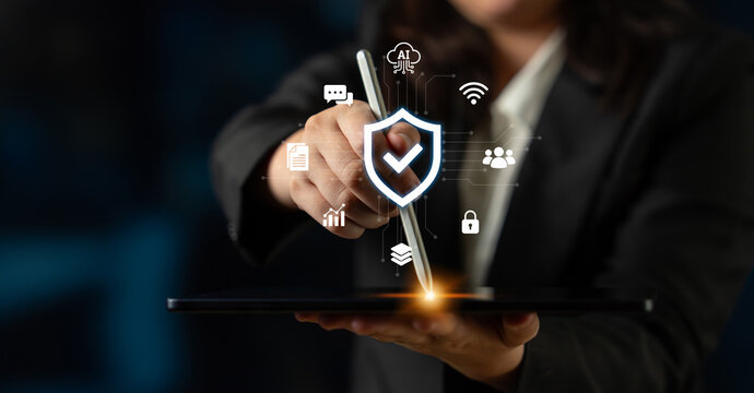 A business professional interacts with a digital tablet showcasing symbols of security, technology, and connectivity, illustrating modern data management practices. Nascent