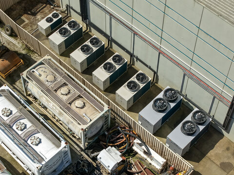 Kilsyth, Victoria, Australia - 20 September 2026: Aerial view of industrial air conditioning units and large storage tanks at a factory site.
