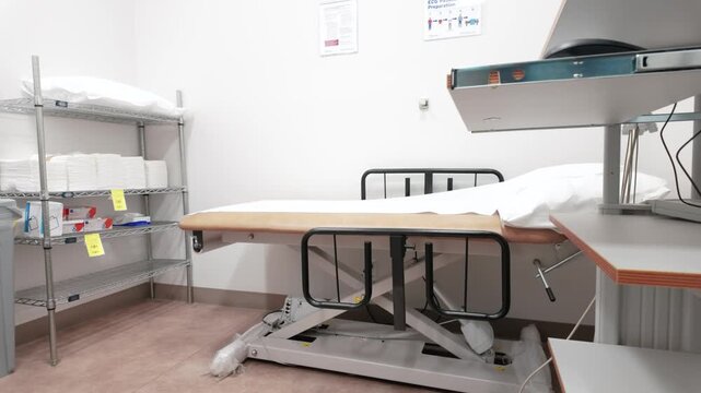 Clinical Examination Room with Adjustable Bed and Medical Storage Shelving