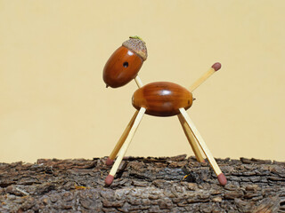 Animal figurine made of acorns and matches. Autumn season © Martina