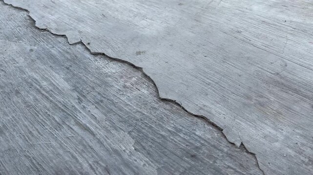 Cracked concrete surface background with abstract grunge texture