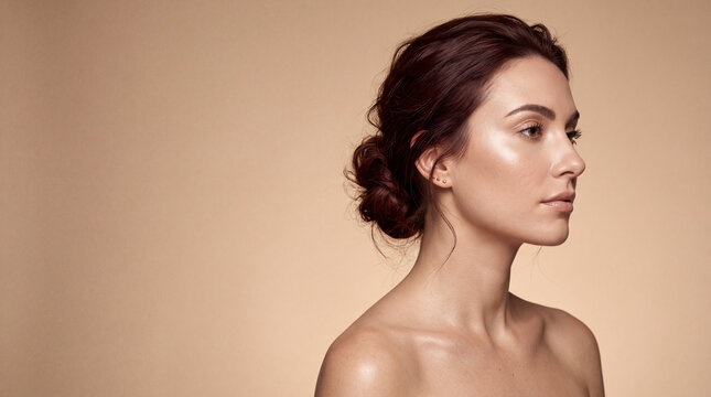Beautiful Woman With Glowing Skin And Elegant Updo Hairstyle