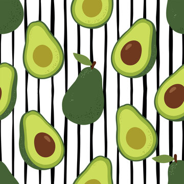 Seamless pattern with fresh green avocado whole and halved with pit on a black and white striped background
