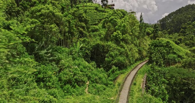 Ella Sri Lanka Aerial v32 cinematic drone flyover along the railway track across Nine Arches Bridge capturing hillside valley and lush jungle views - Shot with Mavic 3 Cine - April 2023