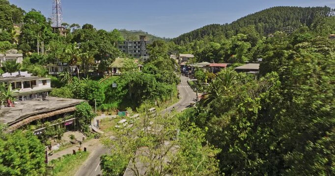Ella Sri Lanka Aerial v37 flyover charming mountain town along the main street capturing hillside resort hotels and roadside shops surrounded by lush greenery - Shot with Mavic 3 Cine - April 2023