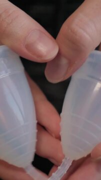 Product Photograph Showcasing Menstrual Cups With Focus On Stem And Rim Features. Highquality Studio Image Emphasizing Translucent Silicone And Design Of Menstrual Cups For Sale Or Catalog