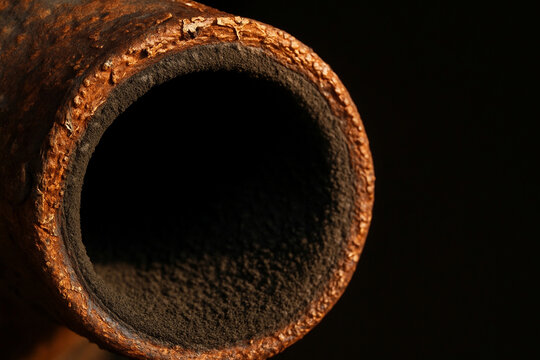 Macro oxidized steel exhaust pipe rim texture with carbon soot buildup for auto insurance