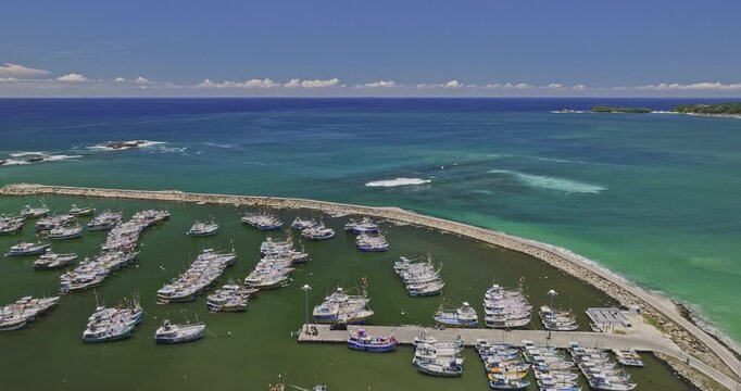 Kudawella Sri Lanka Aerial v1 flyover coastal village capturing fishing boats docked at fishery harbour marina, sandy beach shore and deep blue Indian oceanscape - Shot with Mavic 3 Cine - April 2023