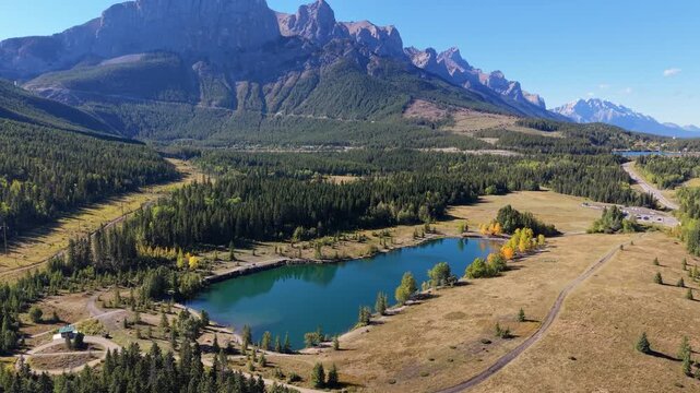 Quarry Lake aerial landscape with autumn yellow trees and majestic Canadian Rockies. Canmore, Alberta, Canada.