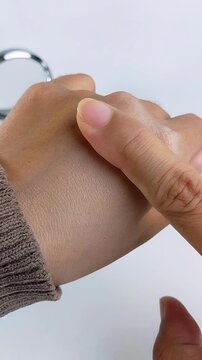 Point of view showing the difference in hand skin after using a brightening moisturizing cream. Before after concept, skin lightening transformation for beauty skincare.