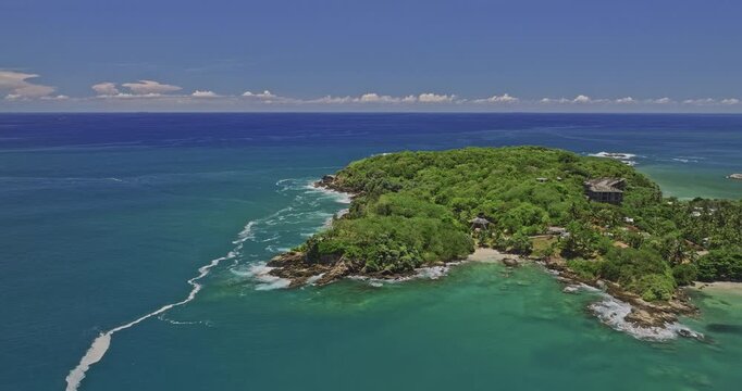 Kudawella Sri Lanka Aerial v3 cinematic flyover and around rocky hillside shore bounded by exotic Indian oceanscape, birds eye view capturing Hummanaya blow hole - Shot with Mavic 3 Cine - April 2023