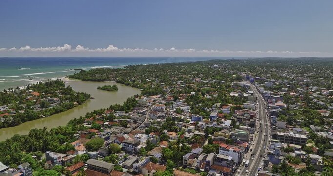 Matara Sri Lanka Aerial v8 drone flyover town center in kadeweediya South capturing Nilwala river, coastal fort and townscape of Thotamuna and Nupe neighborhoods - Shot with Mavic 3 Cine - April 2023