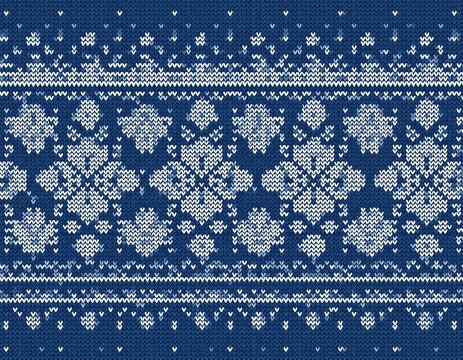 seamless nordic knitting pattern with white geometric snowflakes on blue background