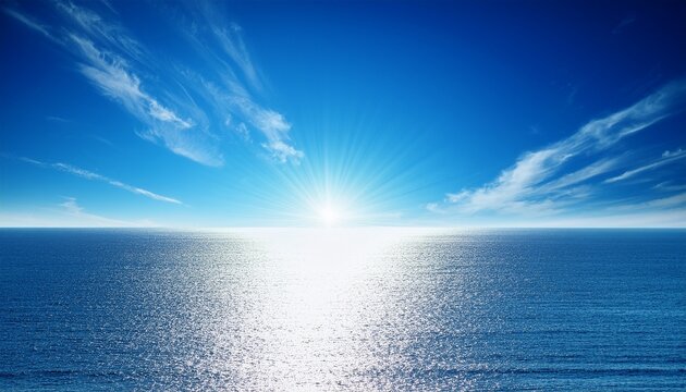 serene ocean horizon under clear blue sky with glistening sun reflection