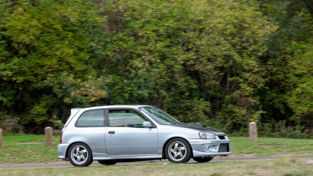 Milton Keynes; UK - Sept. 22nd 2026: 1997 silver Toyota Starlet car driving on a British road