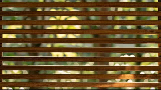 Light moves through wooden slats as the environment changes, revealing various shades of green and brown while the shadows fluctuate.