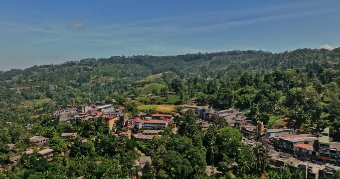 Pussellawa Sri Lanka Aerial v1 flyover village town and A5 road towards hillside Rothschild Tea Estate, capturing highlands tea plantations and mountain landscape - Shot with Mavic 3 Cine - April 2023